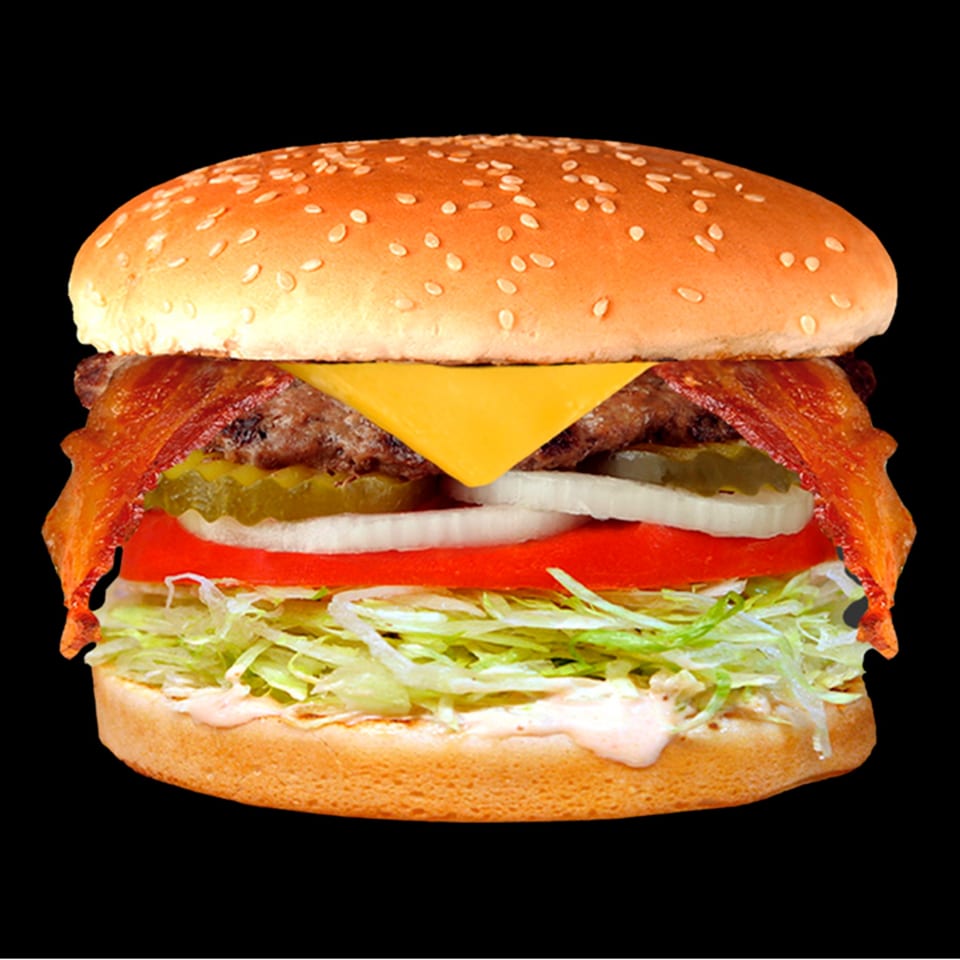 A Jim's Burgers bacon cheeseburger with lettuce, tomato, onion, and pickles on a sesame seed bun.